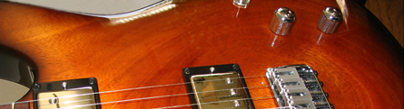 Close up of a guitar by Ken Bennett